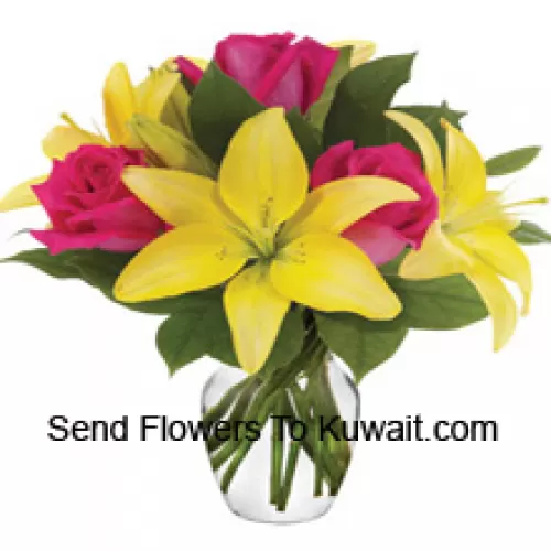 Pink Roses And Yellow Lilies With Seasonal Fillers Arranged Beautifully In A Glass Vase